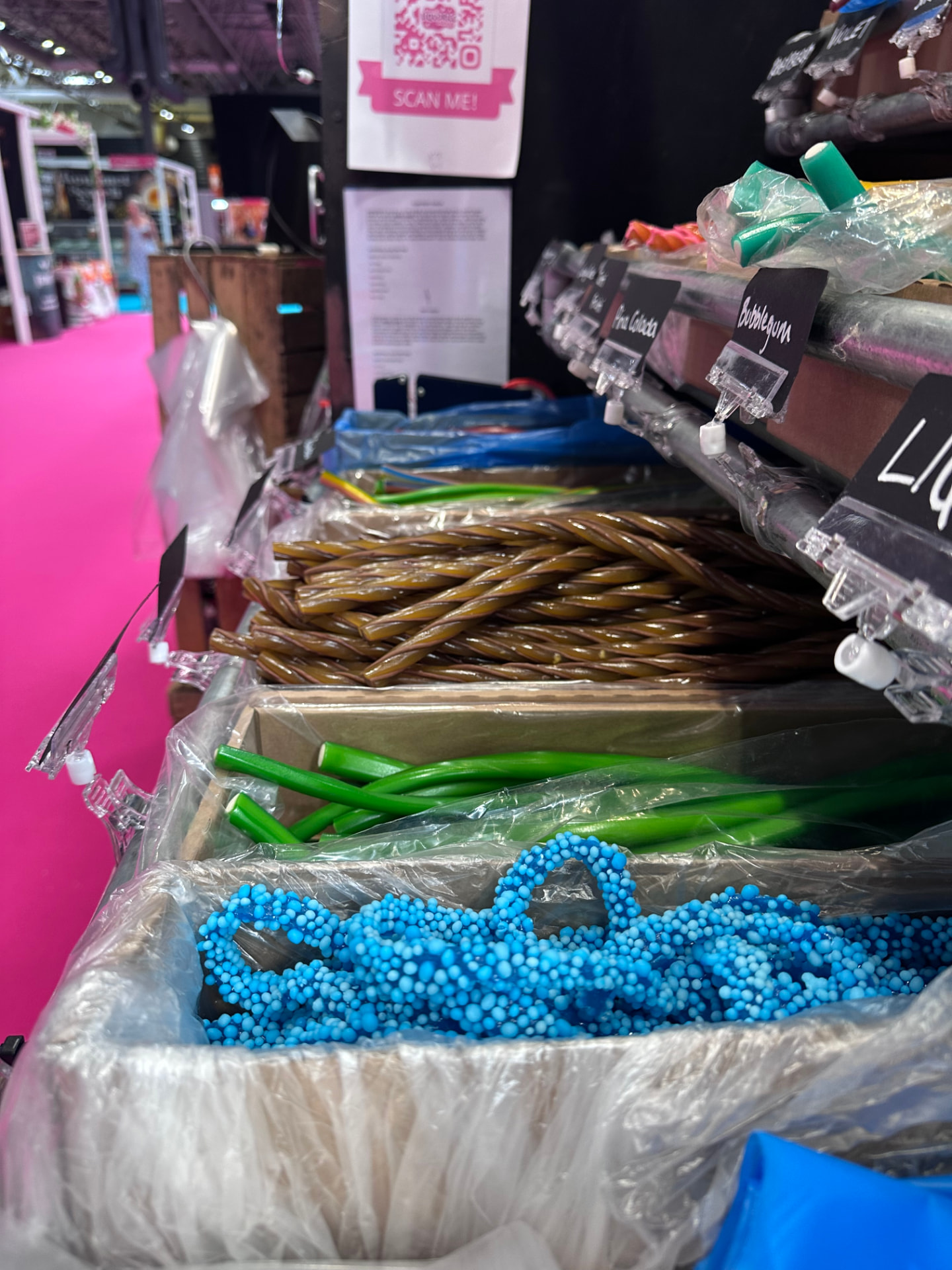 Trays of liquorice cables including green apple and blue fizzy cables.