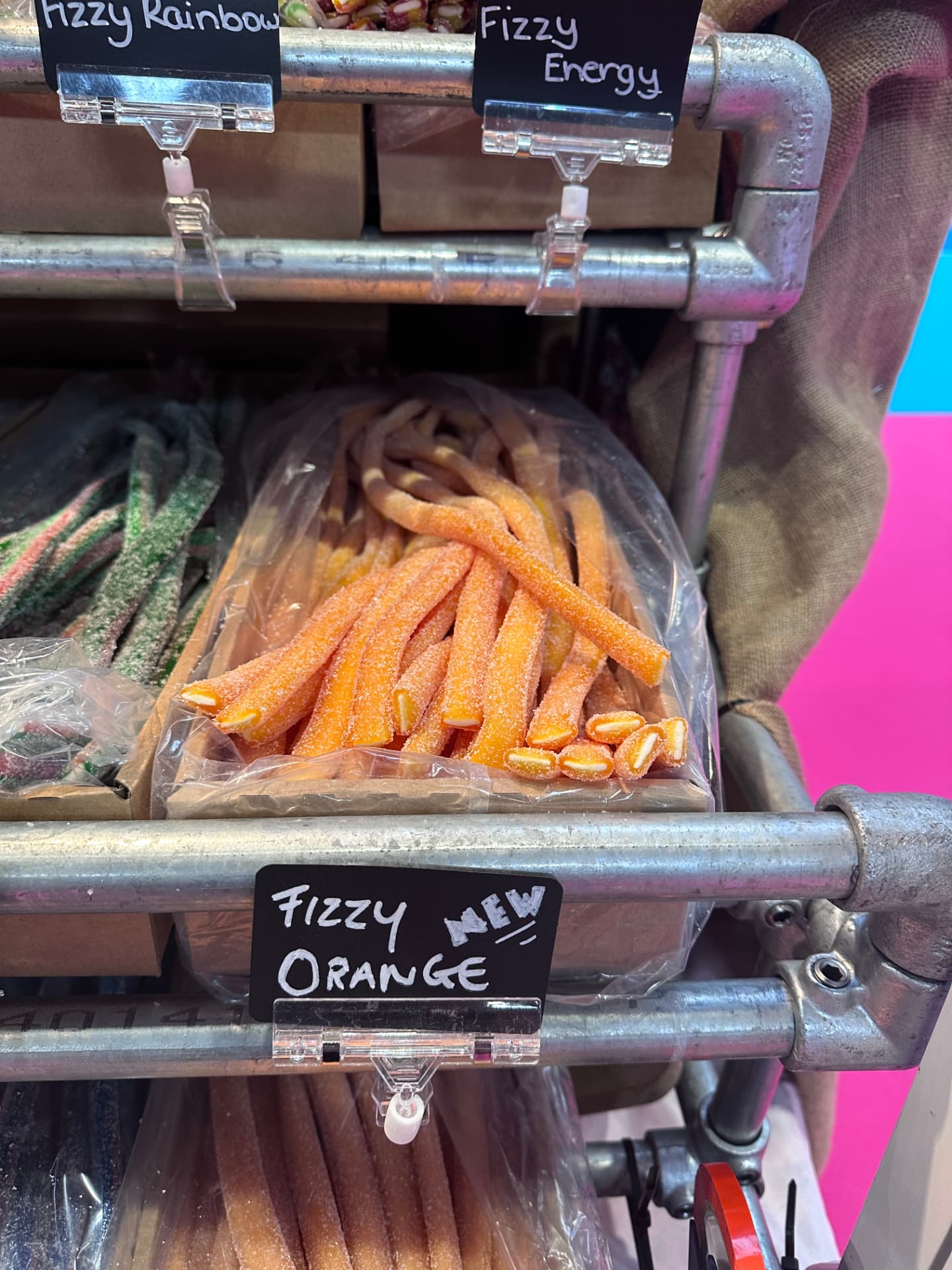 Fizzy orange liquorice cables with a handwritten label at our stand.