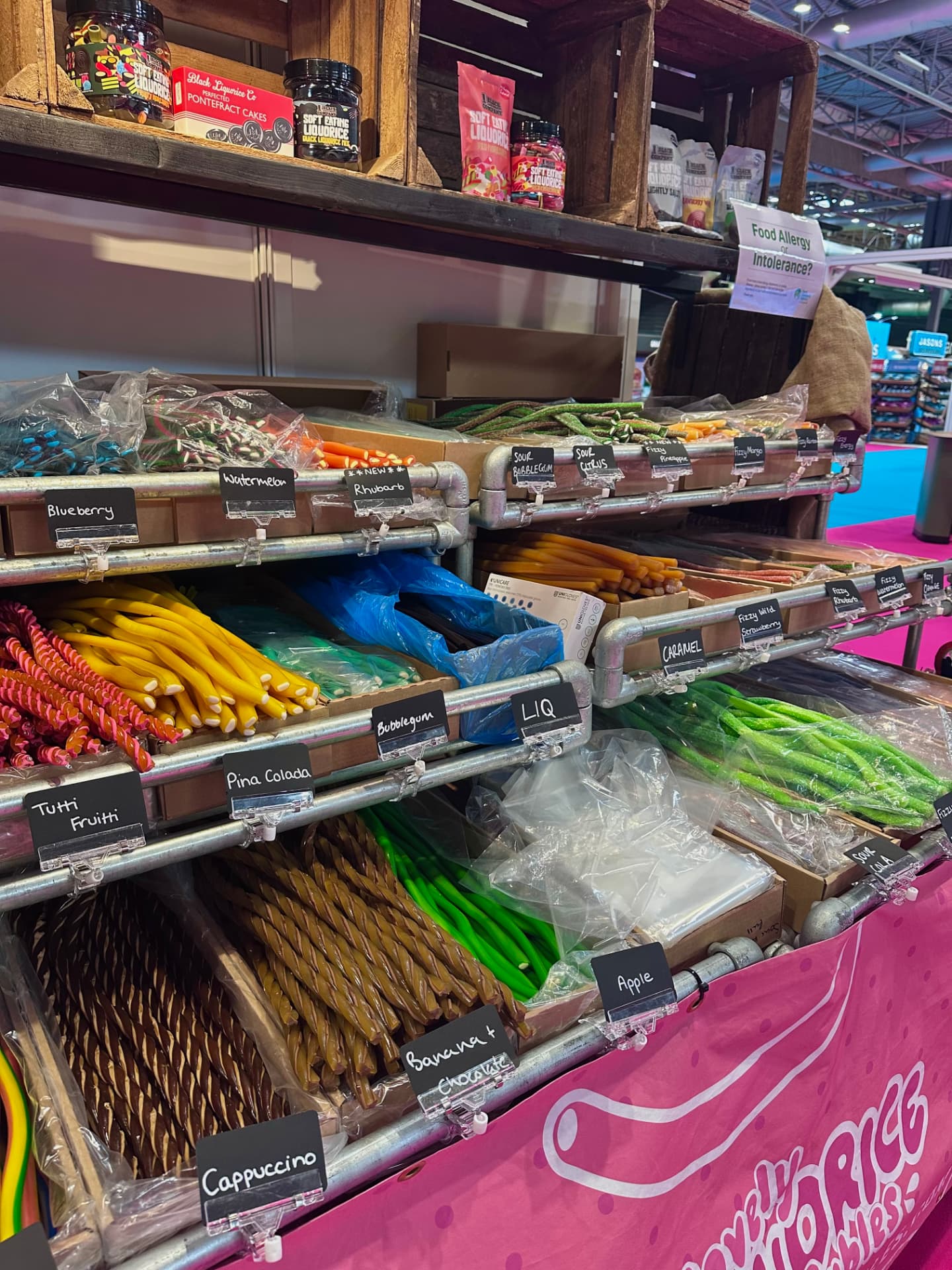 Rows of colourful liquorice cable flavours with handwritten labels on our stand.